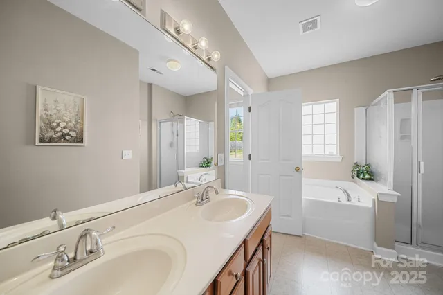 a bedroom that has a bed and a chair