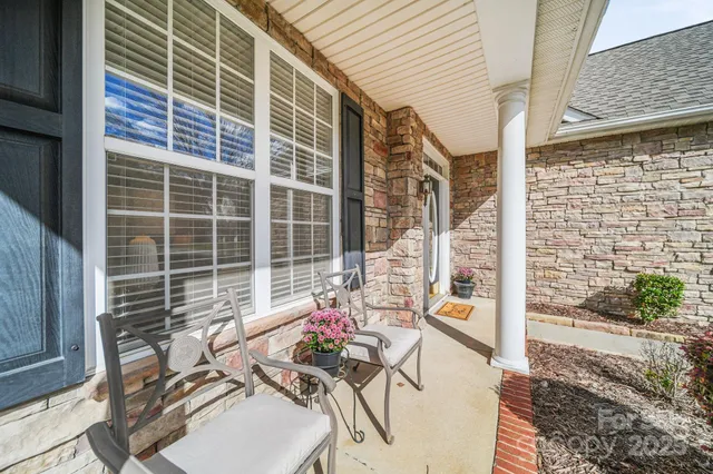 a view of a hallway with windows