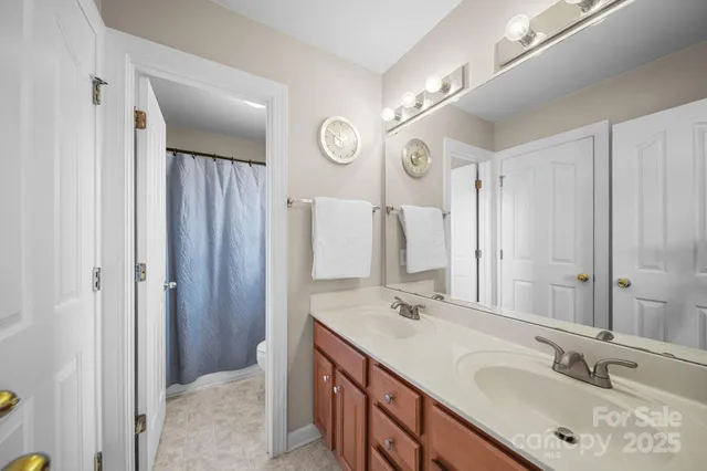 a living room with furniture and a ceiling fan