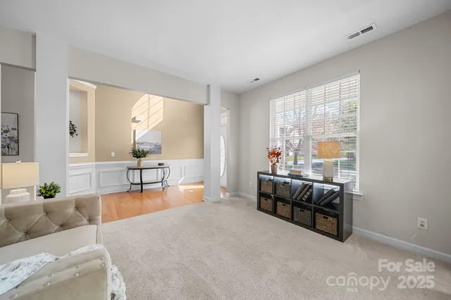 a view of a workspace with a window and lounge chair