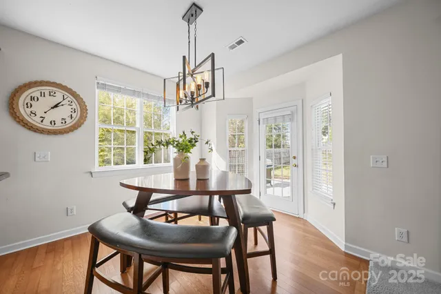 a living room with furniture and a lamp