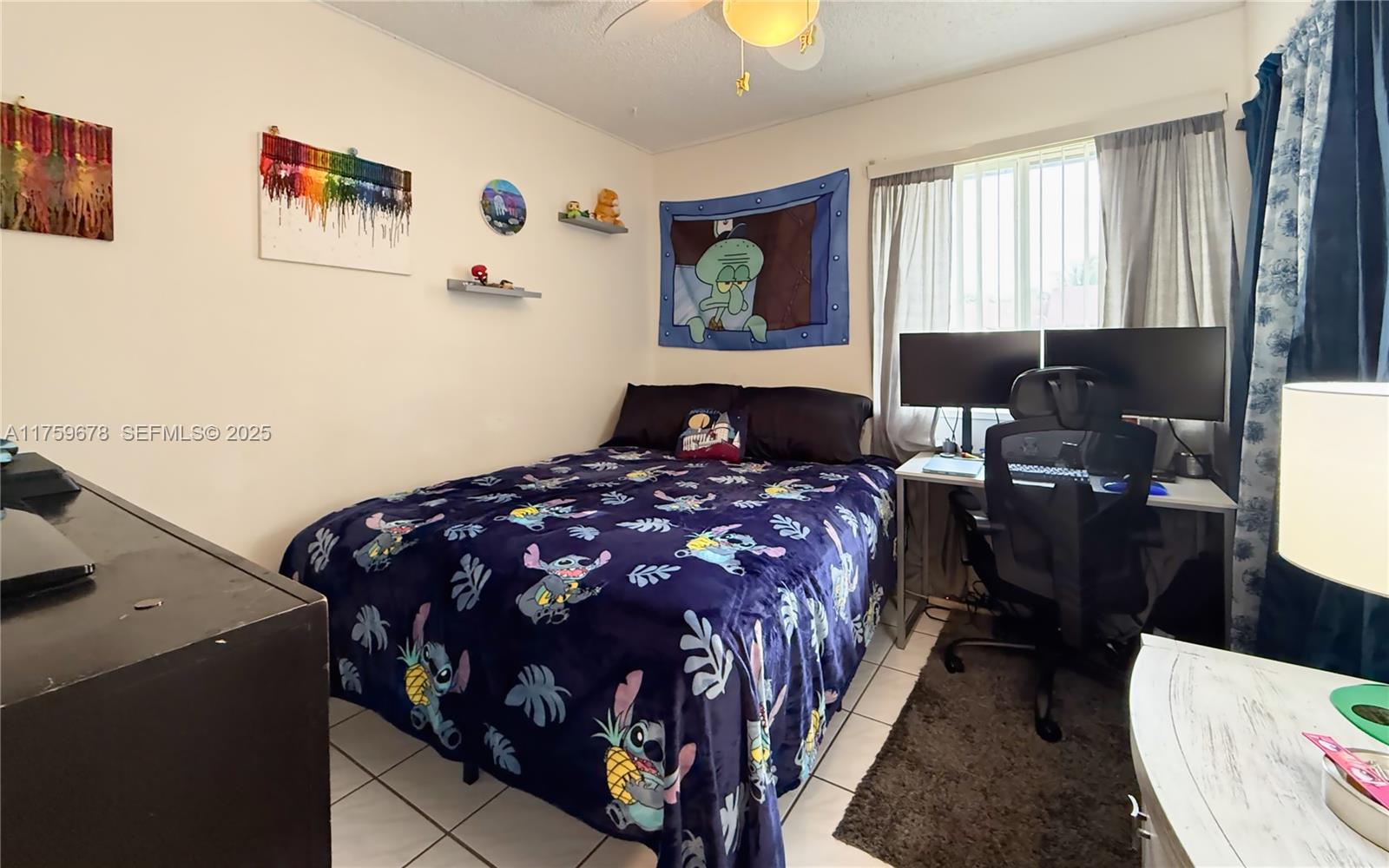 20520 Southwest 124th Place Miami, FL 33177 - Photo 13 of 34 a bedroom with a bed and wooden floor