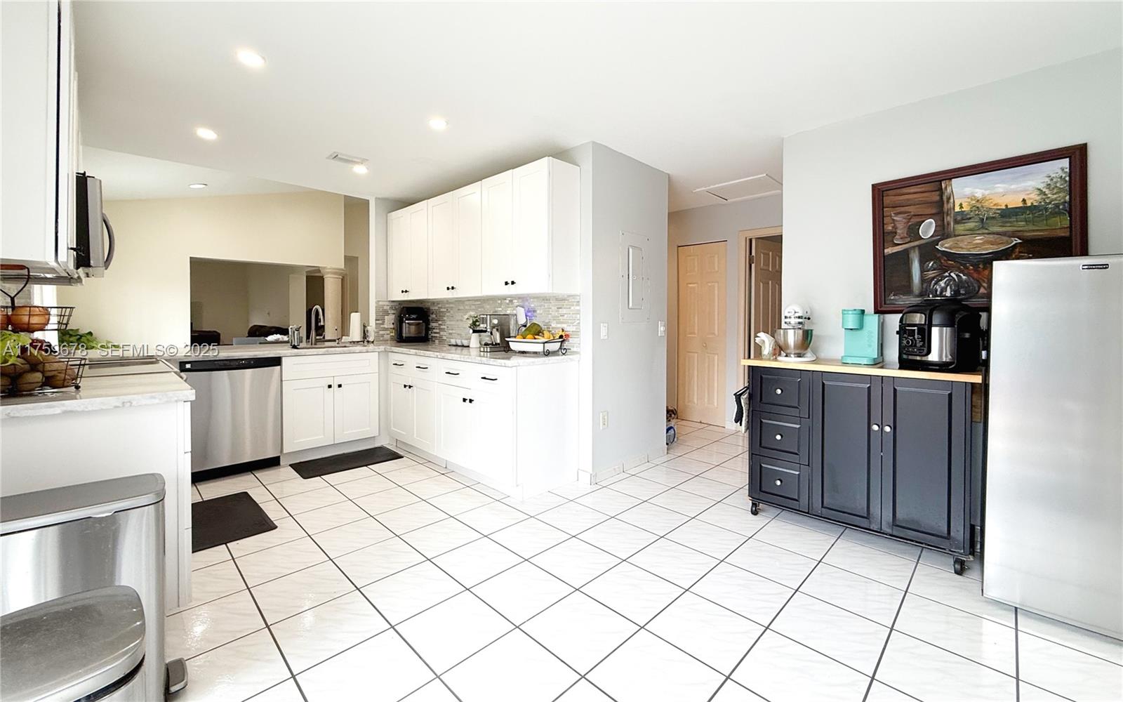 20520 Southwest 124th Place Miami, FL 33177 - Photo 20 of 34 a kitchen with a cabinets a sink and a counter top space