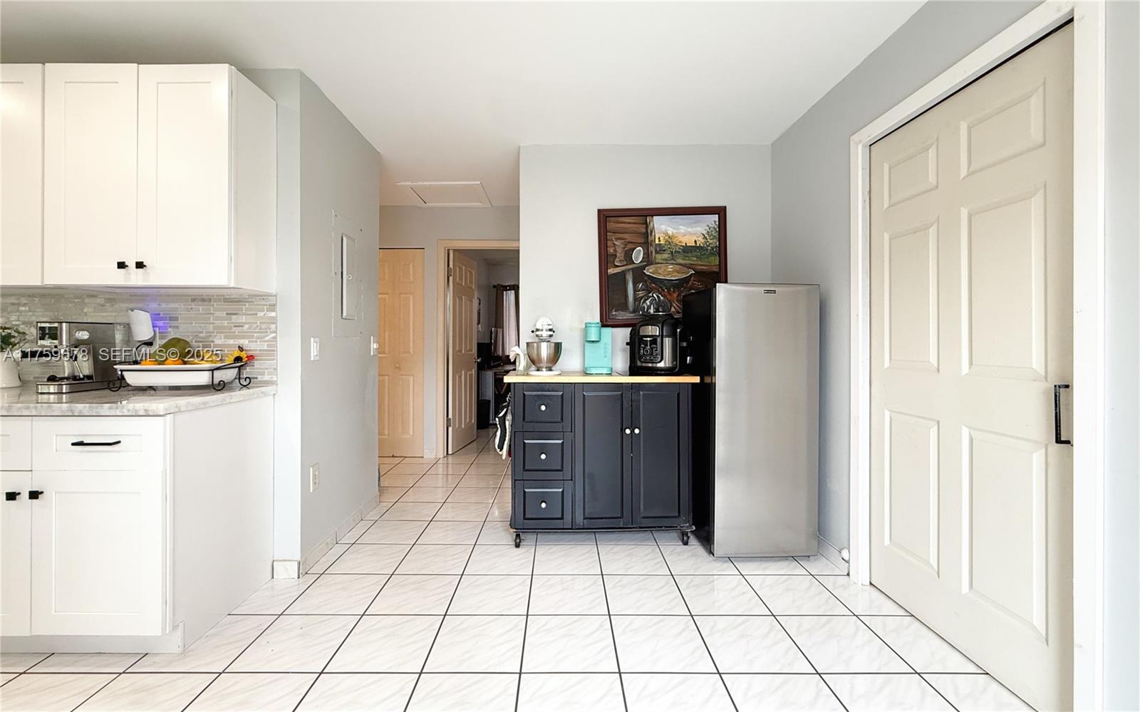 20520 Southwest 124th Place Miami, FL 33177 - Photo 22 of 34 a kitchen with stainless steel appliances a refrigerator and a cabinets