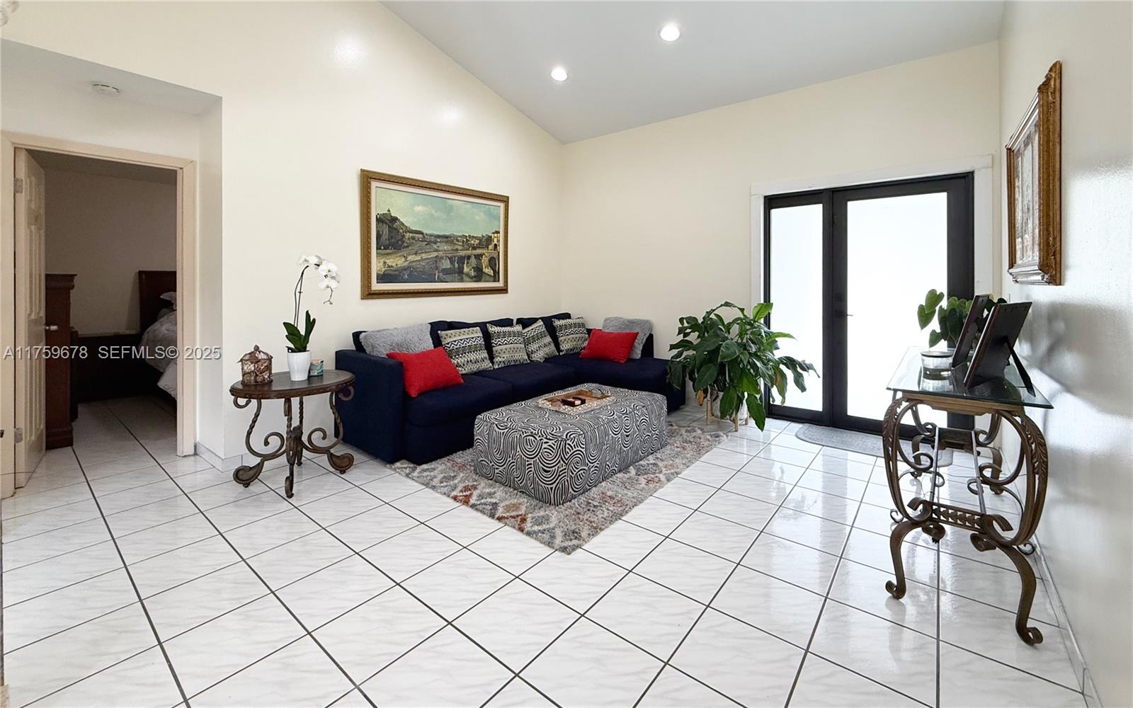 20520 Southwest 124th Place Miami, FL 33177 - Photo 3 of 34 a living room with furniture and white walls