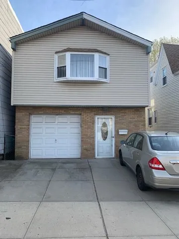 a view of a car parked in front of a house