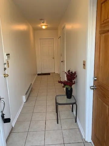 a hallway with a potted plant