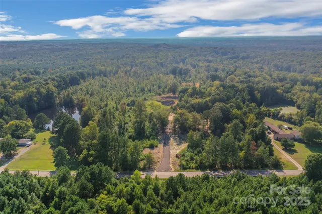 a view of a lake and green valley