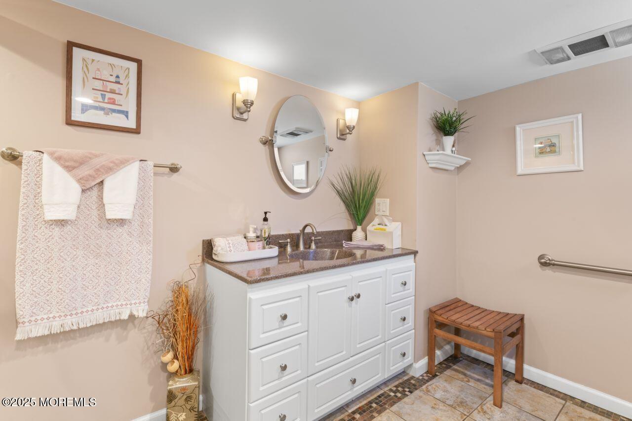 31 Cedar Avenue South Amboy, NJ 08879 - Photo 20 of 41 a bathroom with a granite countertop sink mirror and vanity