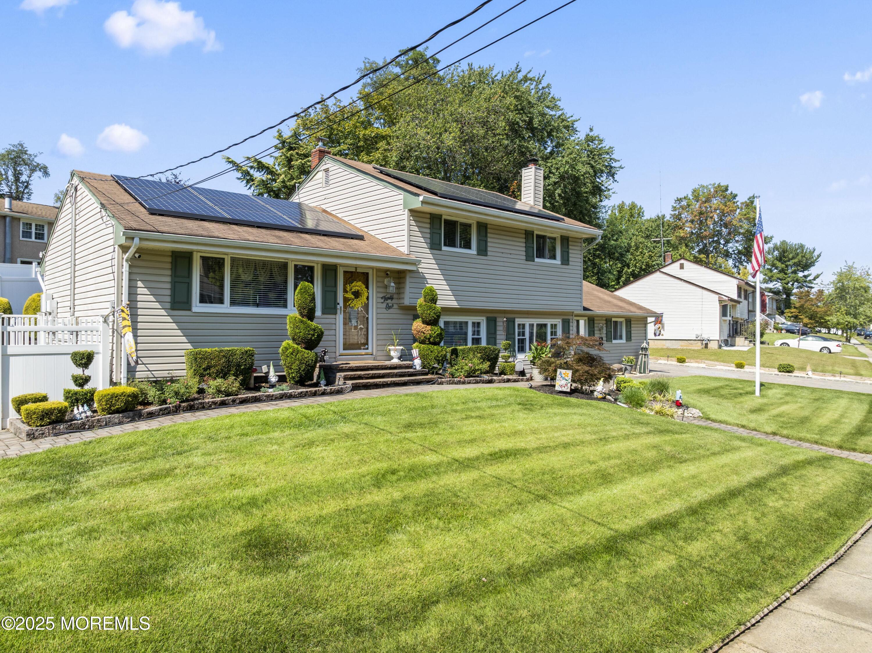 31 Cedar Avenue South Amboy, NJ 08879 - Photo 2 of 41 a front view of a house with a yard table and chairs