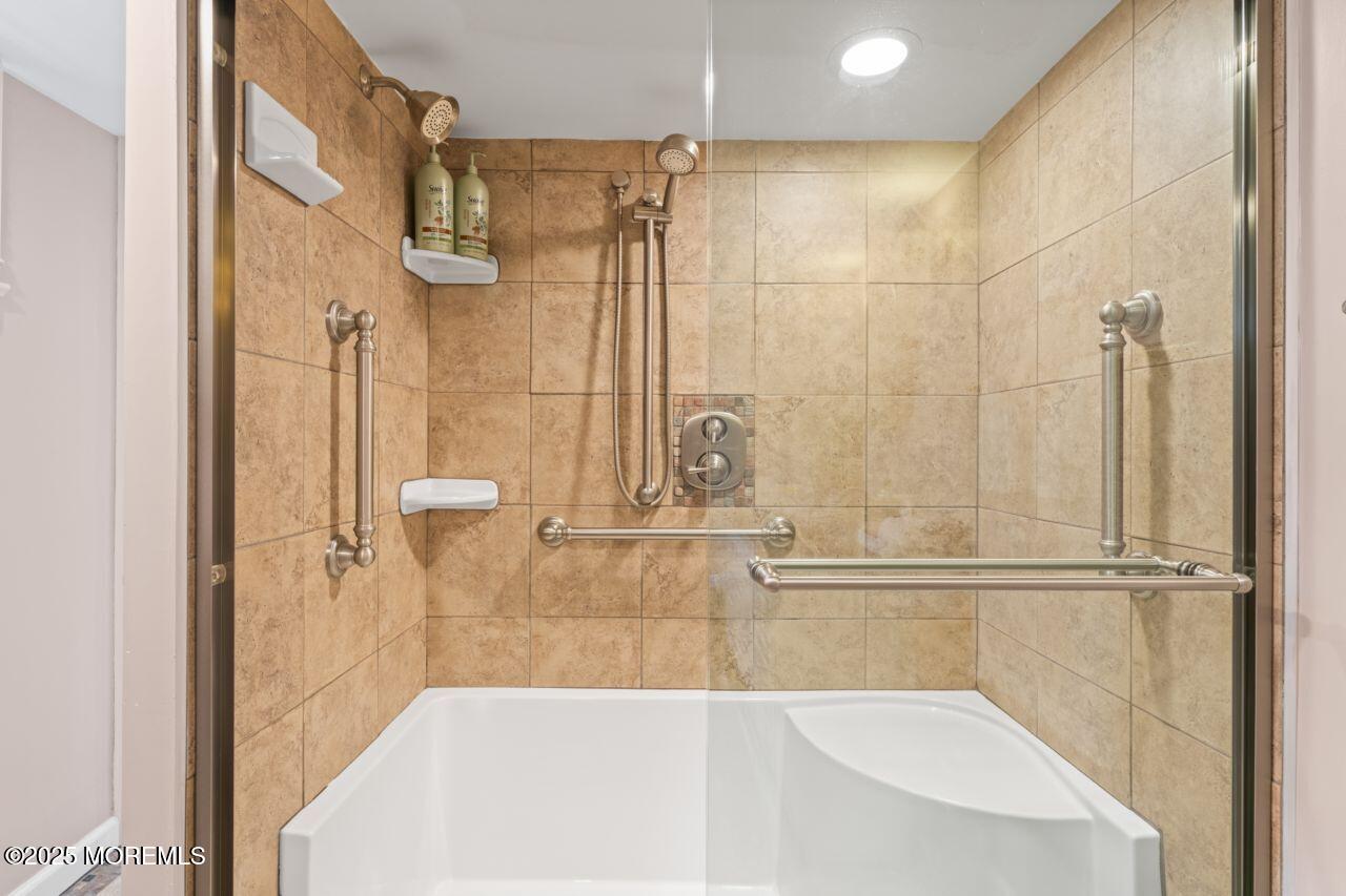 31 Cedar Avenue South Amboy, NJ 08879 - Photo 21 of 41 a bathroom with a tub and shower