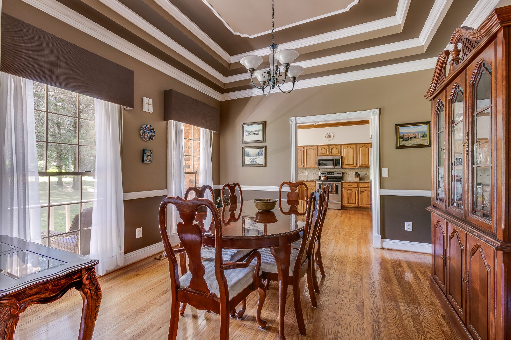 1111 Temple Ridge Court Nashville, TN 37221 - Photo 11 of 46 a view of a dining room with furniture window and wooden floor