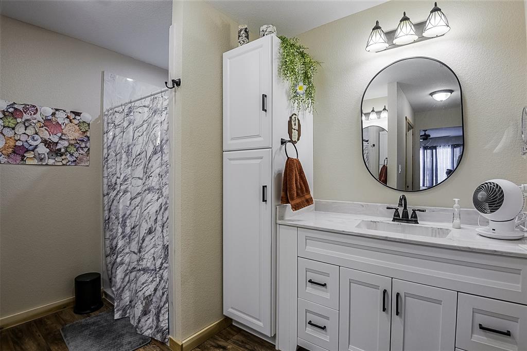 2683 Bells Chapel Road Palmer, TX 75152 - Photo 13 of 30 a bathroom with a double vanity sink and a mirror
