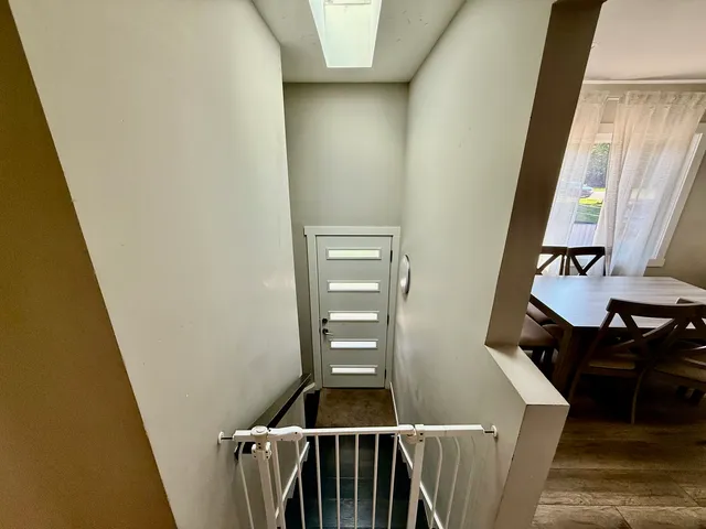 a view of stairs and furniture