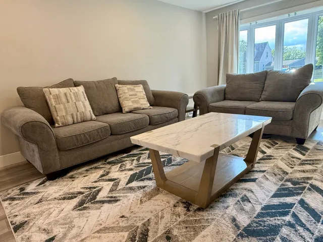 a living room with furniture and a couch