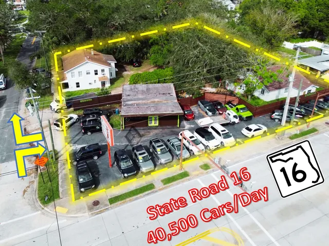 a view of outdoor space with signage and flags