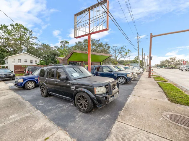 a view of a cars park in front of a building