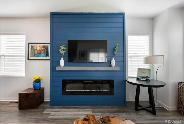 a view of a livingroom with furniture window and wooden floor