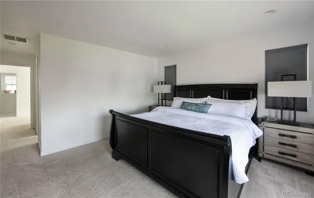 a spacious bathroom with a shower sink and mirror