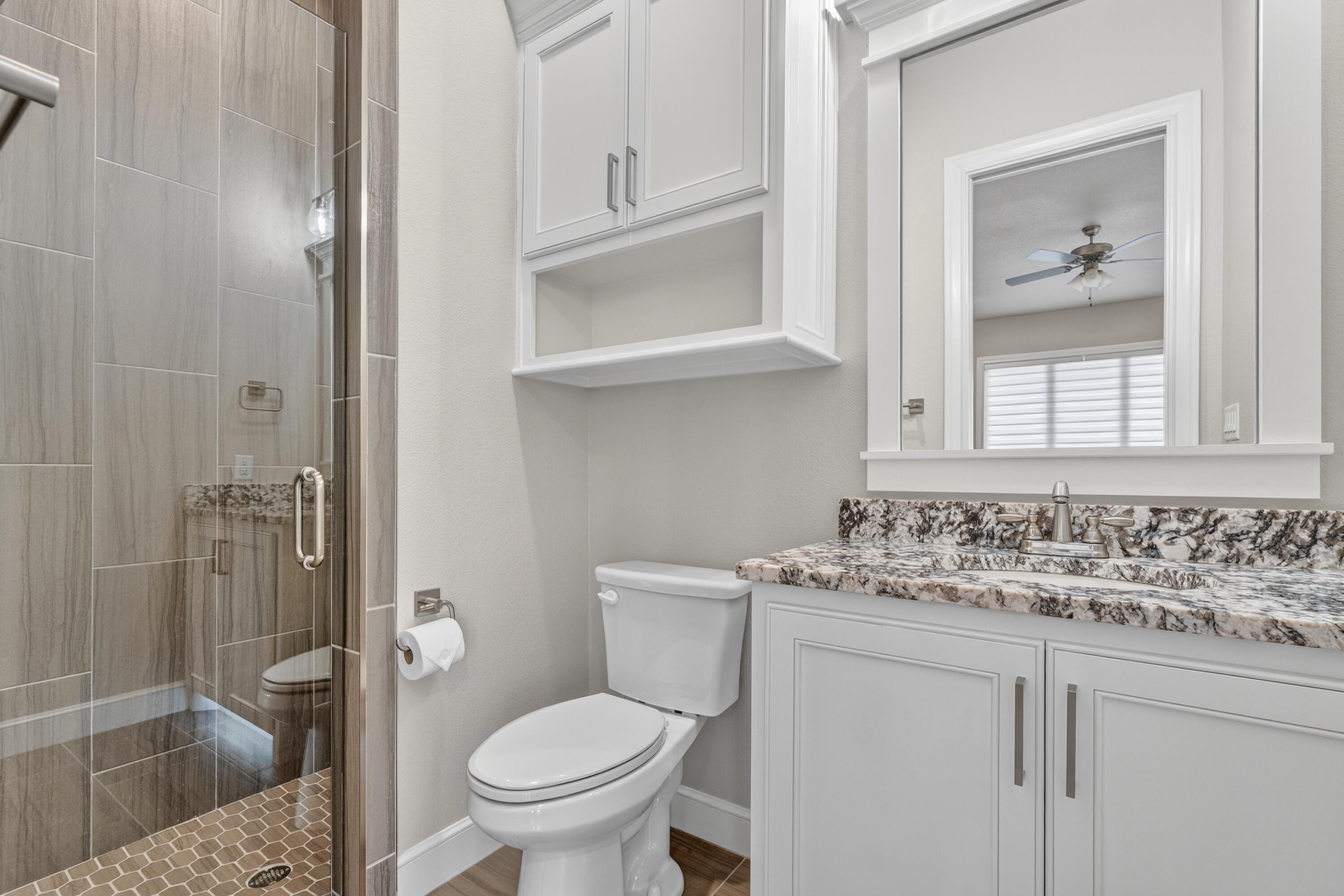 4003 140th Street Lubbock, TX 79423 - Photo 16 of 50 a bathroom with a granite countertop sink toilet and shower