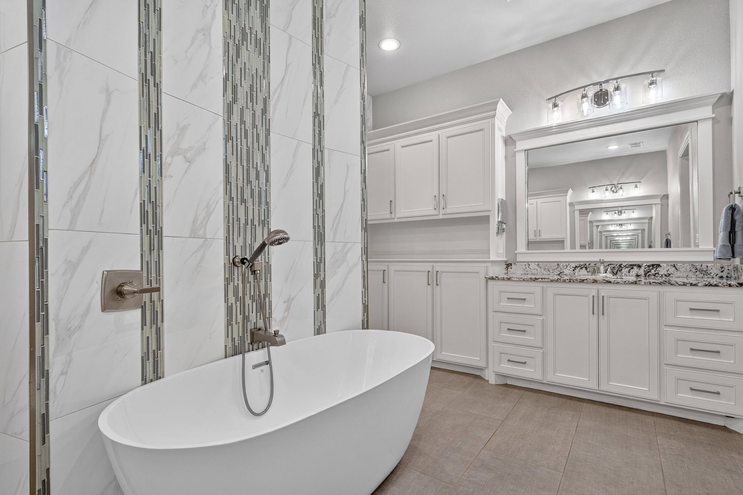 4003 140th Street Lubbock, TX 79423 - Photo 20 of 50 a bathroom with a sink and a mirror
