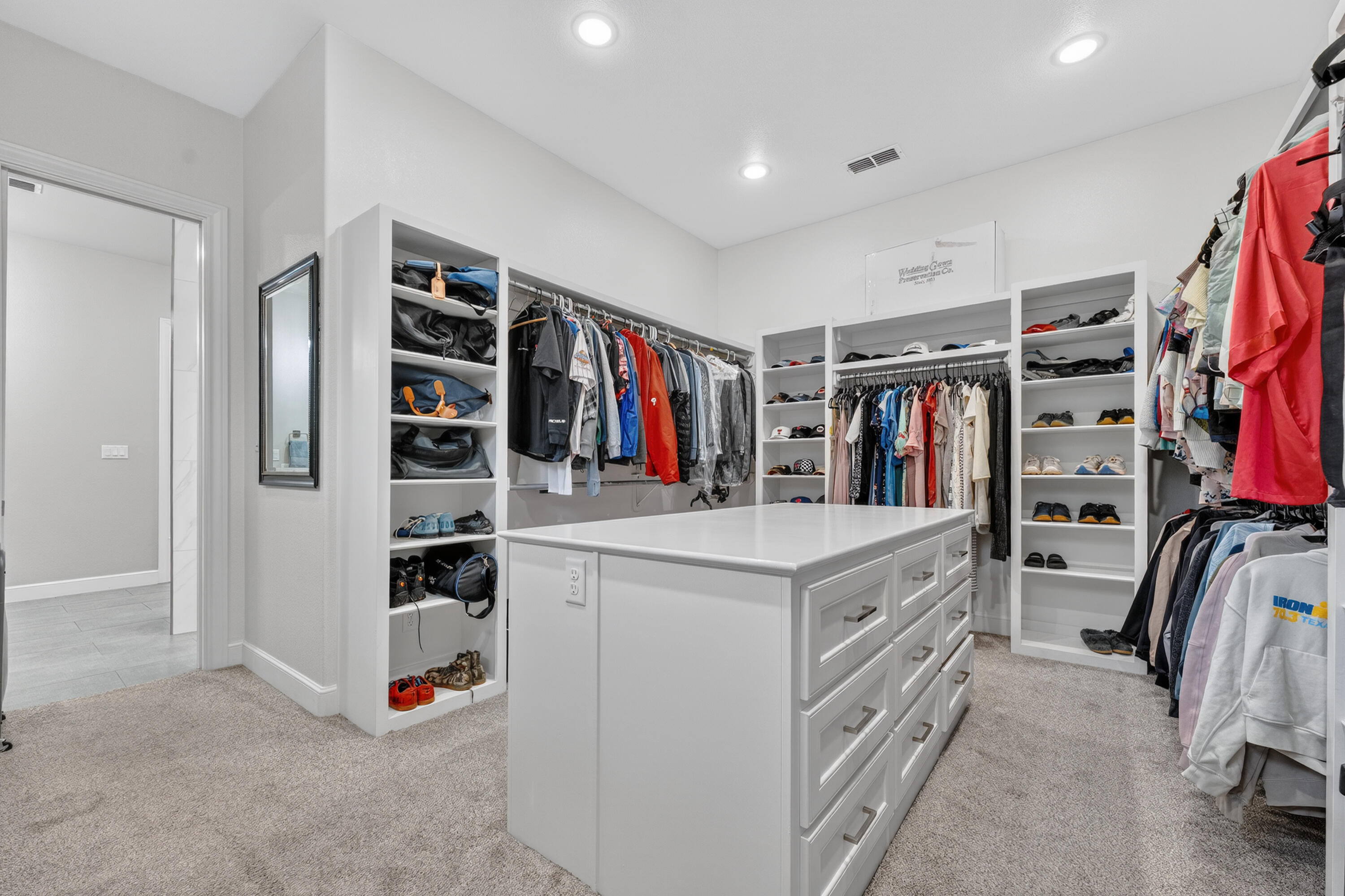 4003 140th Street Lubbock, TX 79423 - Photo 24 of 50 a view of walk in closet with clothes and shoes