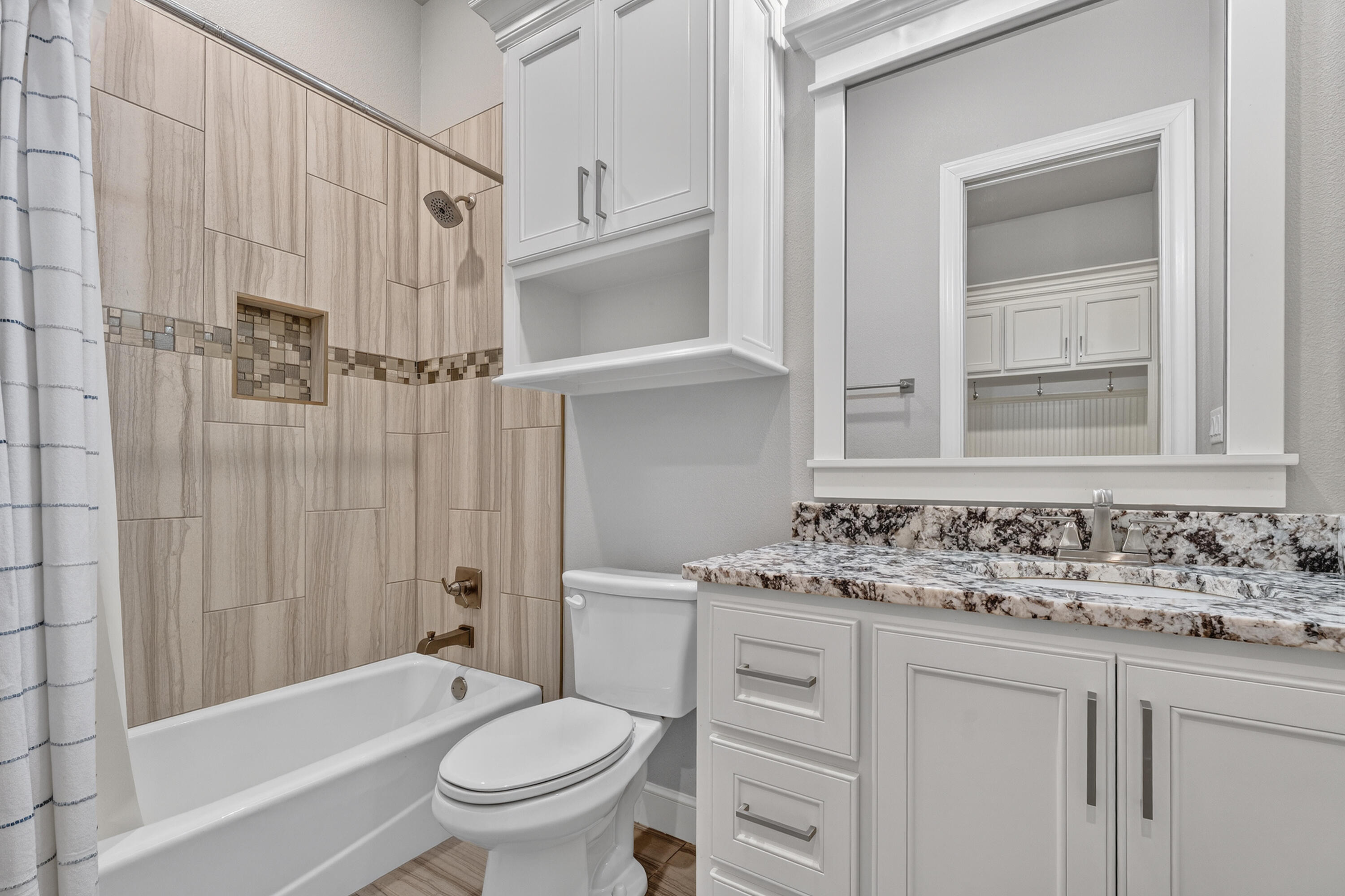 4003 140th Street Lubbock, TX 79423 - Photo 34 of 50 a bathroom with a sink toilet vanity and shower