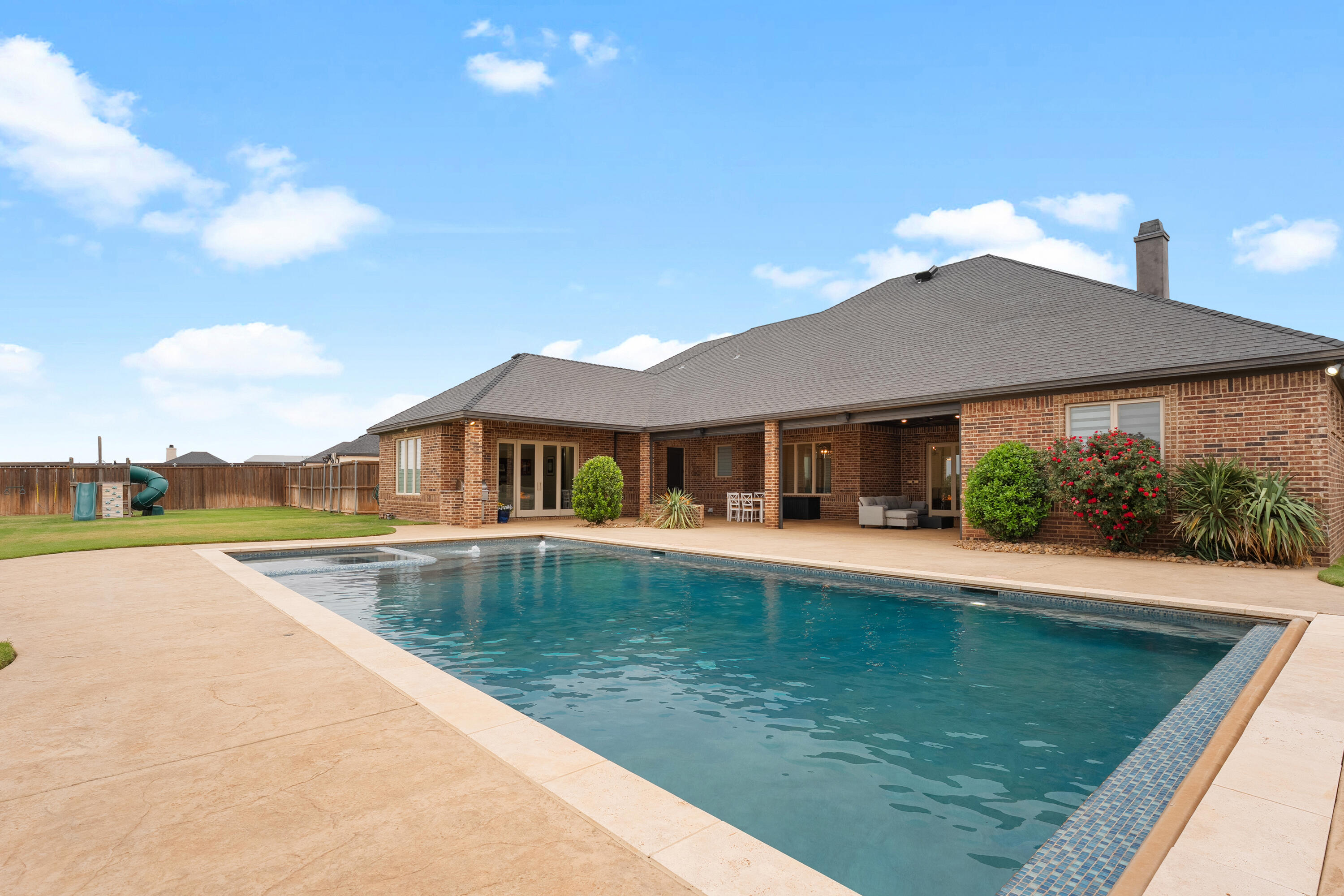 4003 140th Street Lubbock, TX 79423 - Photo 42 of 50 a view of pool with umbrella and seating area