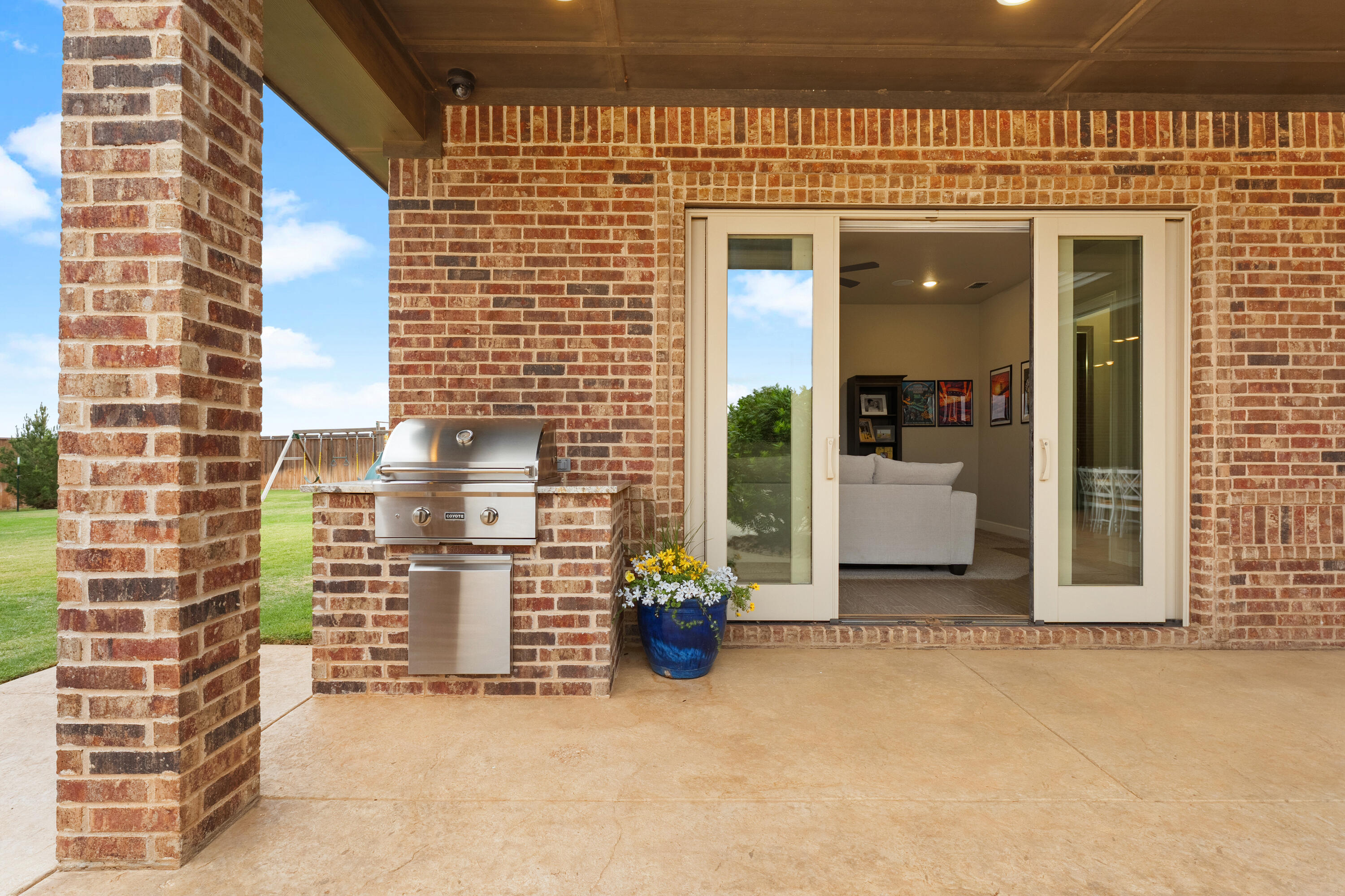 4003 140th Street Lubbock, TX 79423 - Photo 46 of 50 a view of a patio with table and chairs and potted plants
