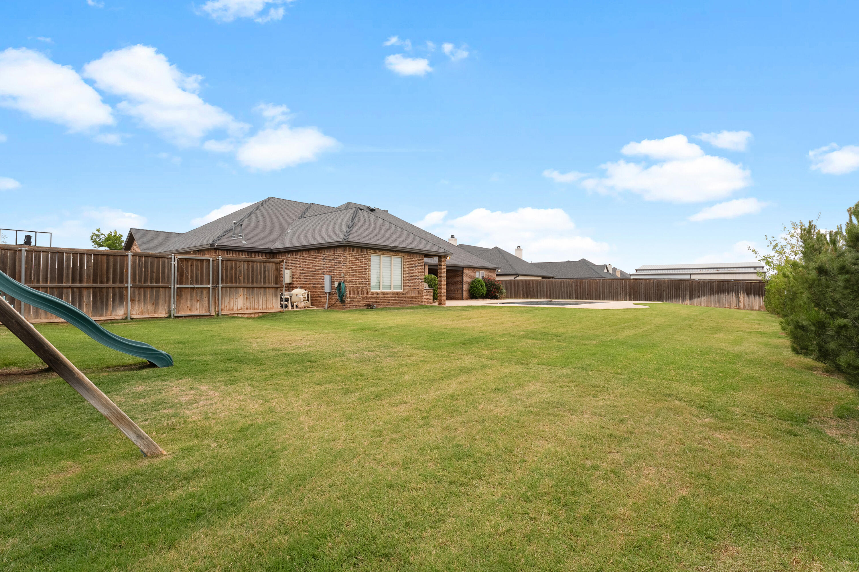 4003 140th Street Lubbock, TX 79423 - Photo 48 of 50 a view of a house with a yard table and chairs