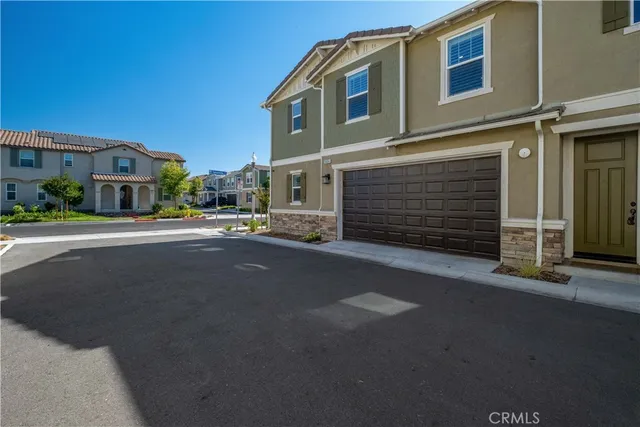 an aerial view of residential building with green space