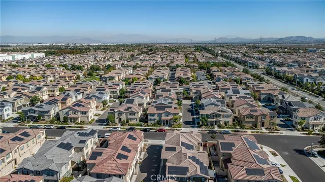 a view of a patio with a table and chairs under an umbrella