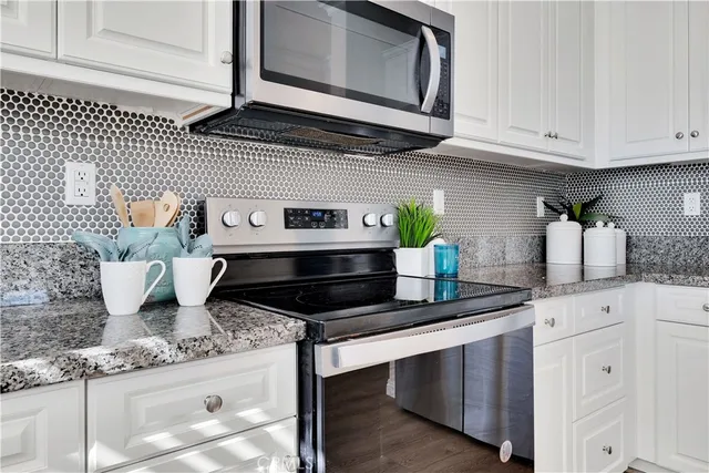 a bedroom with bed and a night stand