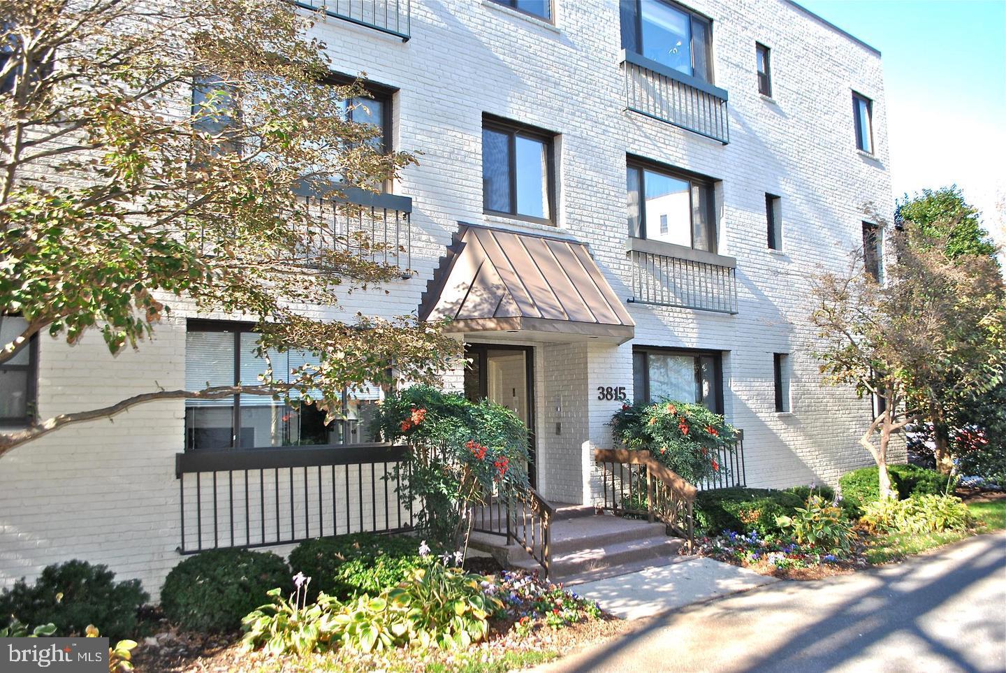 3815 Davis Place Northwest, Unit 1 Washington, DC 20007 - Photo 1 of 14 Charming brick facade with lush greenery.