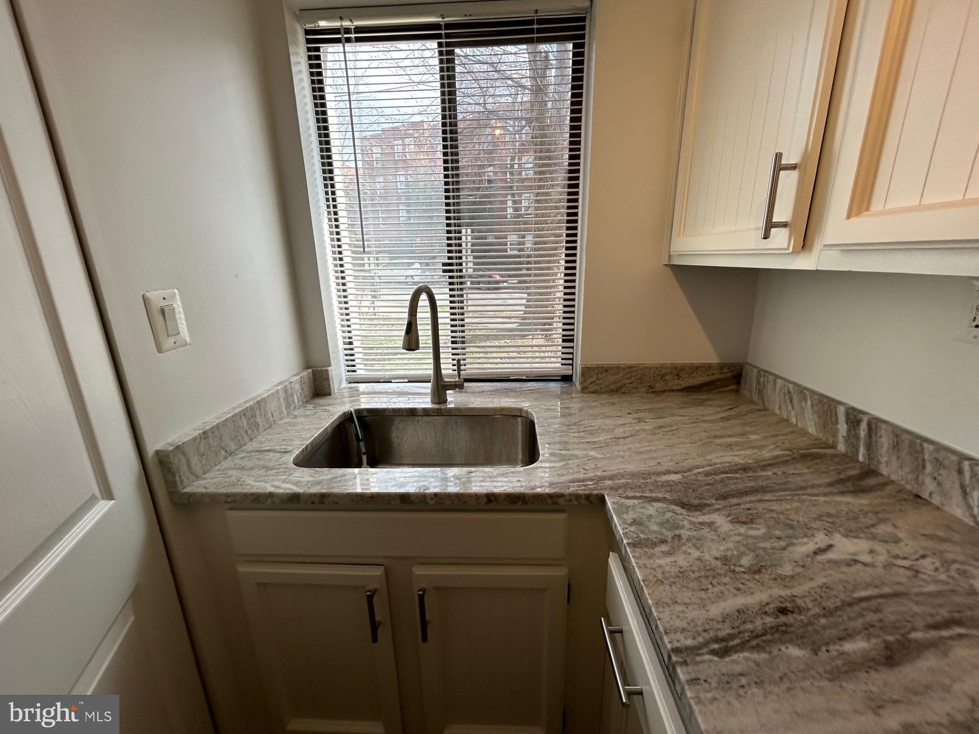 3815 Davis Place Northwest, Unit 1 Washington, DC 20007 - Photo 5 of 14 Modern kitchen with sleek finishes.