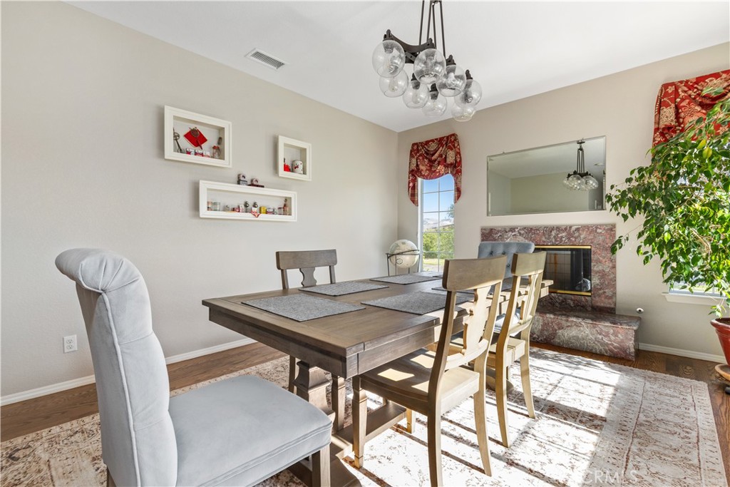 4375 Rustic Way San Luis Obispo, CA 93401 - Photo 14 of 65 a view of a dining room with furniture and a potted plant
