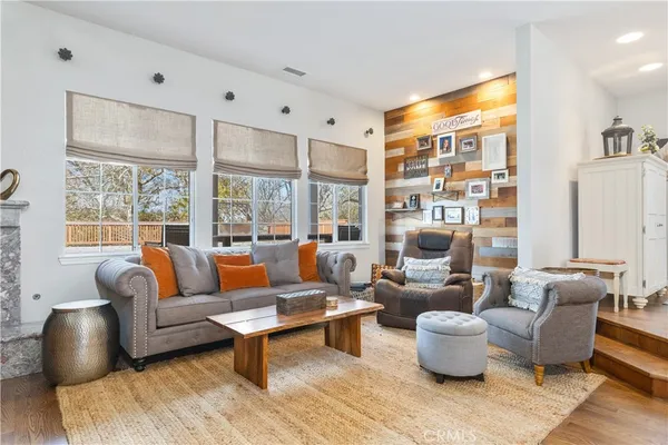 a view of a kitchen counter top space with furniture and a flat screen tv