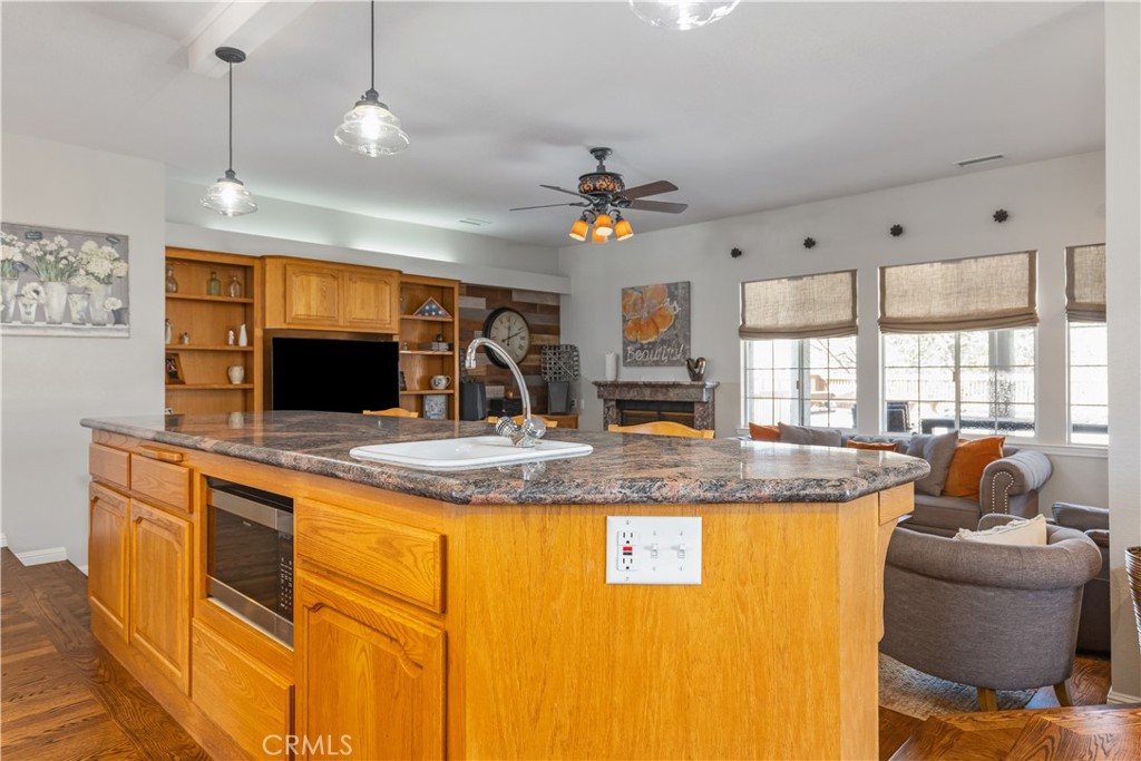 4375 Rustic Way San Luis Obispo, CA 93401 - Photo 22 of 65 a view of a kitchen counter top space with furniture and a flat screen tv