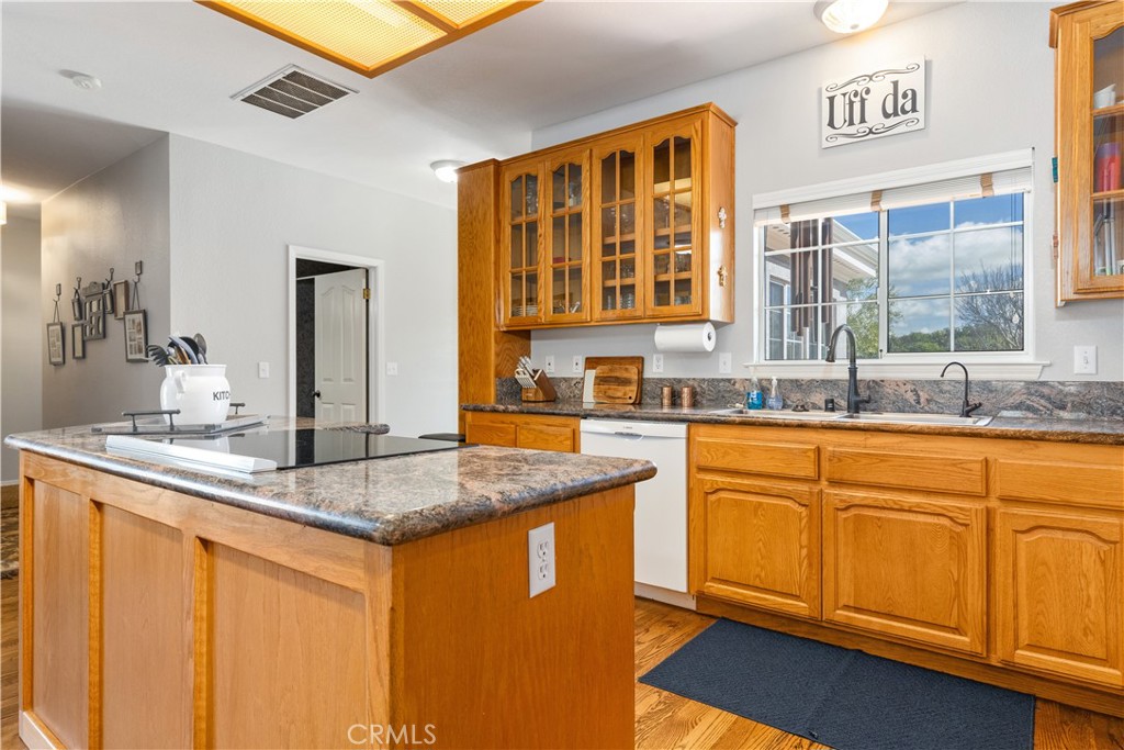 4375 Rustic Way San Luis Obispo, CA 93401 - Photo 24 of 65 a kitchen with stainless steel appliances granite countertop a sink stove and cabinets