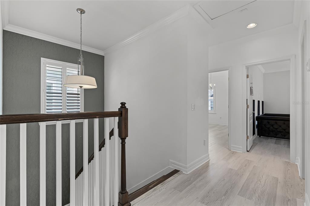 1515 Resolute Street Celebration, FL 34747 - Photo 20 of 56 a view of a hallway with wooden floor and stairs