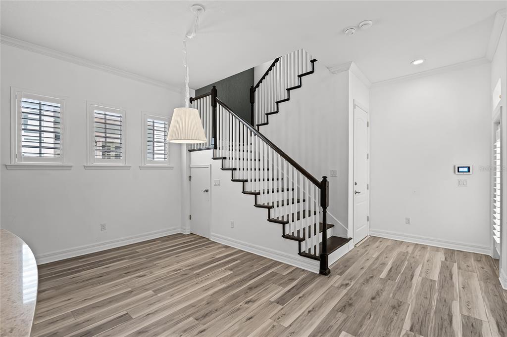 1515 Resolute Street Celebration, FL 34747 - Photo 21 of 56 a view of entryway and hall with wooden floor