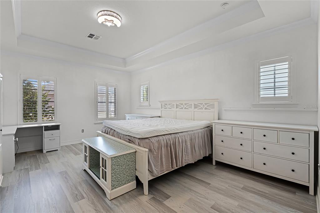 1515 Resolute Street Celebration, FL 34747 - Photo 22 of 56 a spacious bedroom with a bed and a window