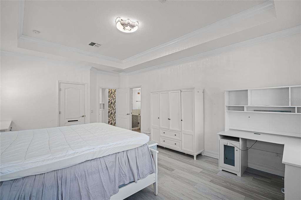 1515 Resolute Street Celebration, FL 34747 - Photo 23 of 56 a spacious bedroom with a bed and a window