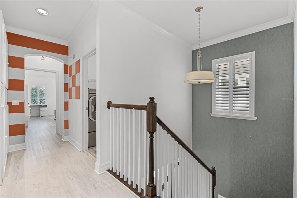 1515 Resolute Street Celebration, FL 34747 - Photo 26 of 56 a view of a hallway with windows
