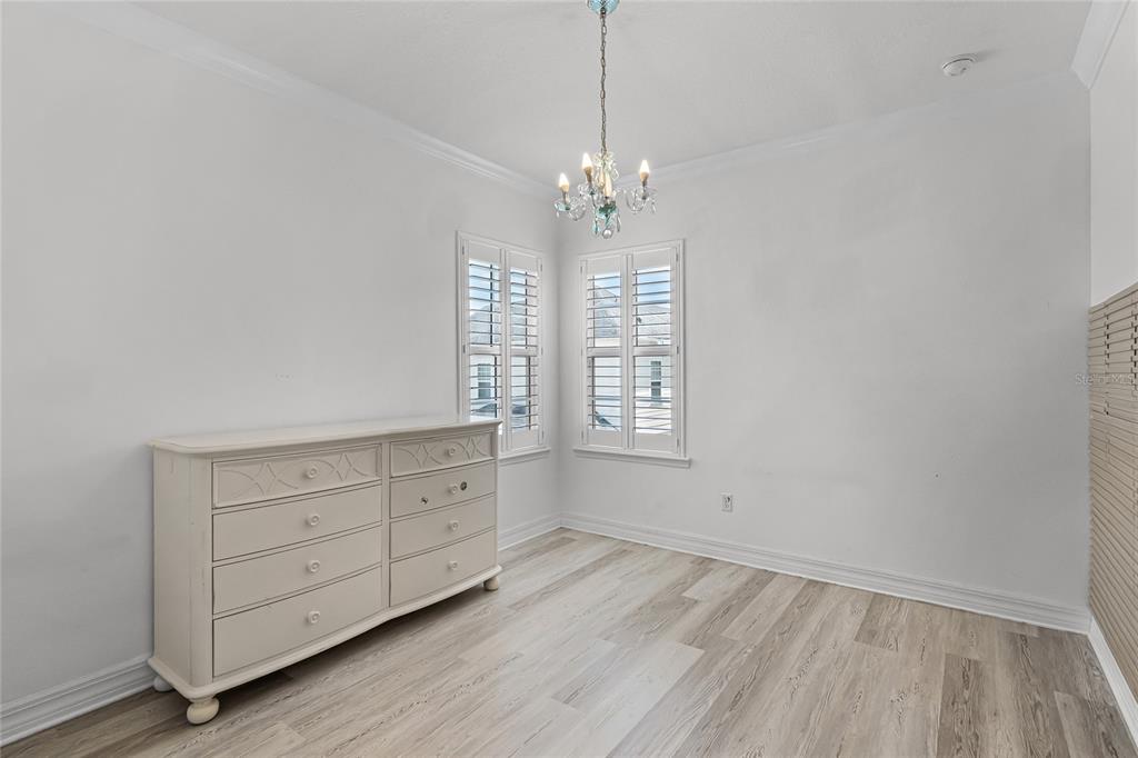 1515 Resolute Street Celebration, FL 34747 - Photo 29 of 56 a view of an empty room with a window and wooden floor