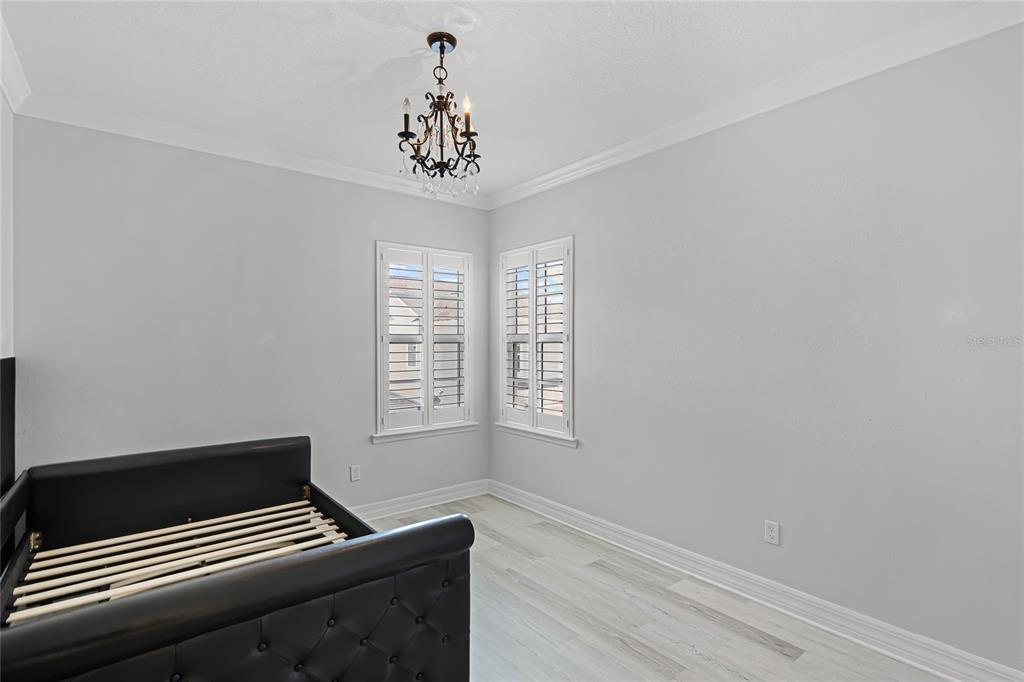 1515 Resolute Street Celebration, FL 34747 - Photo 32 of 56 a view of wooden floor and chandelier in a room
