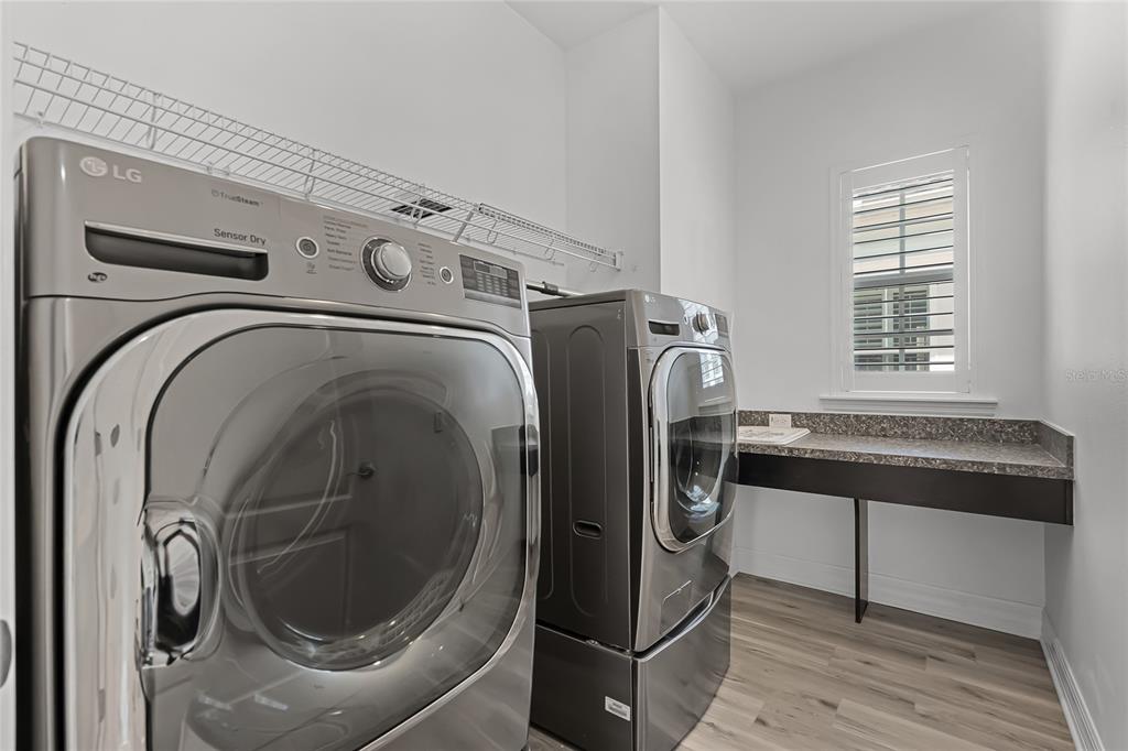 1515 Resolute Street Celebration, FL 34747 - Photo 34 of 56 a utility room with dryer and washer