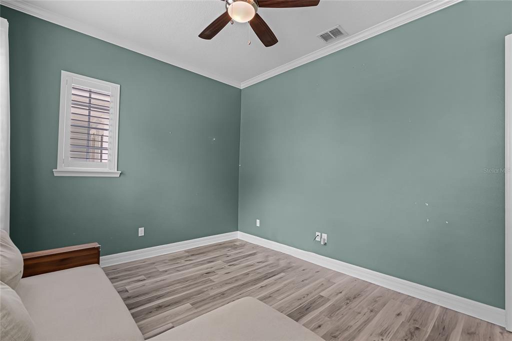 1515 Resolute Street Celebration, FL 34747 - Photo 5 of 56 a bedroom with a bed and a window