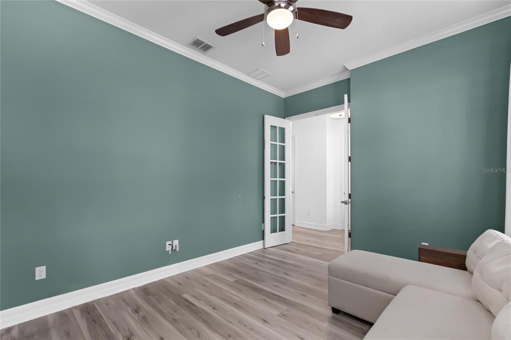 1515 Resolute Street Celebration, FL 34747 - Photo 6 of 56 an empty room with a ceiling fan and a window