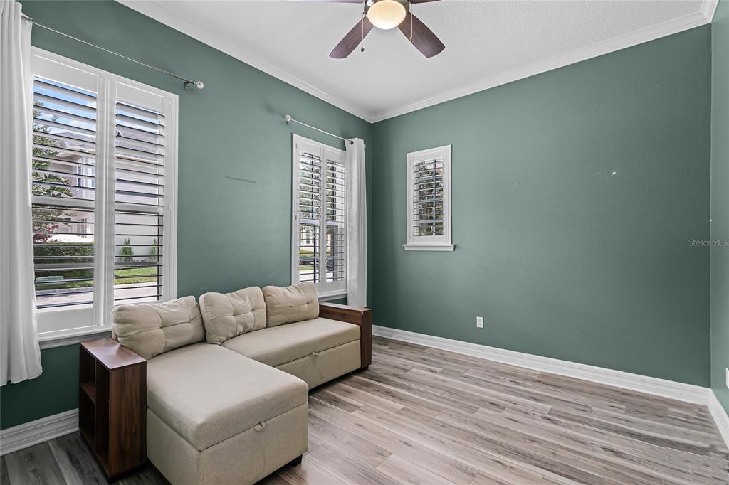 1515 Resolute Street Celebration, FL 34747 - Photo 7 of 56 a living room with furniture and a window